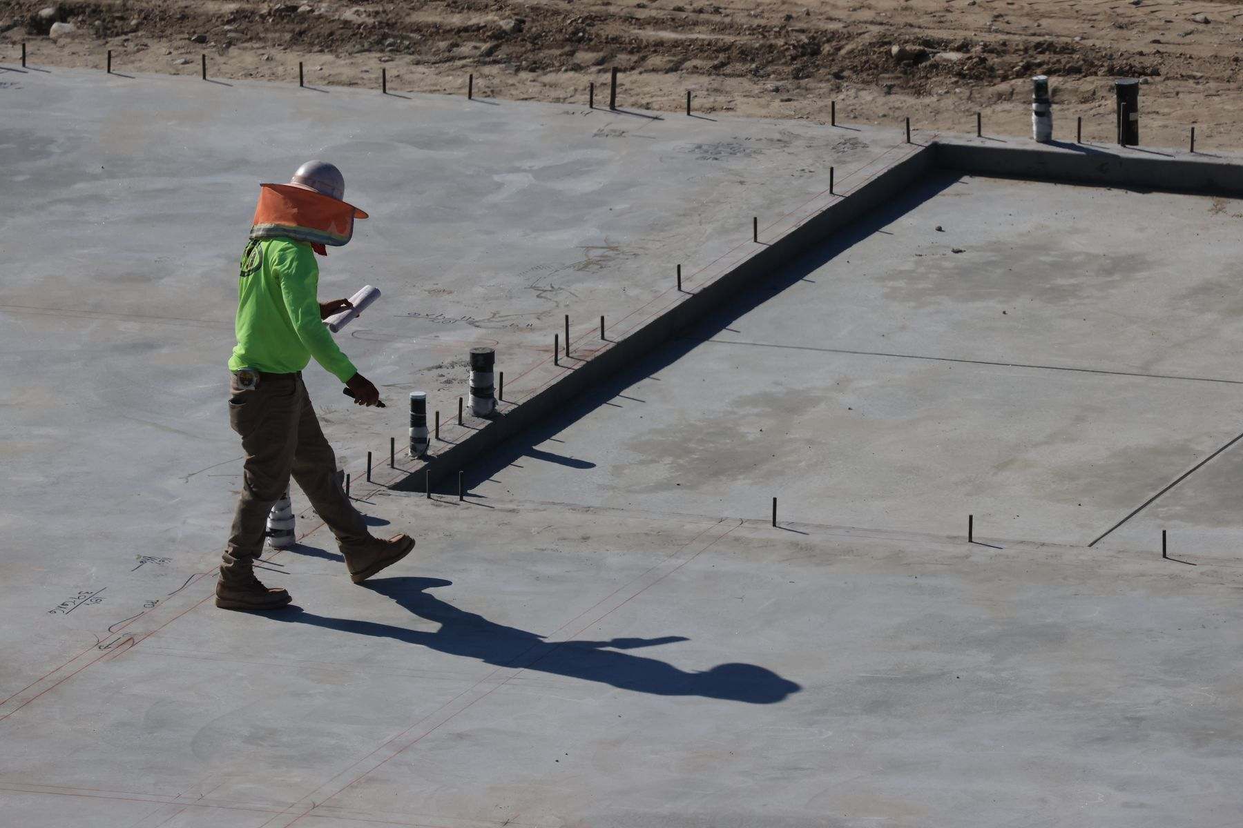Slab leak repair Albany OR: plumbing lines rising through a poured concrete slab foundation